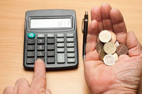 Help needed with a handful of coins left Stock Photos