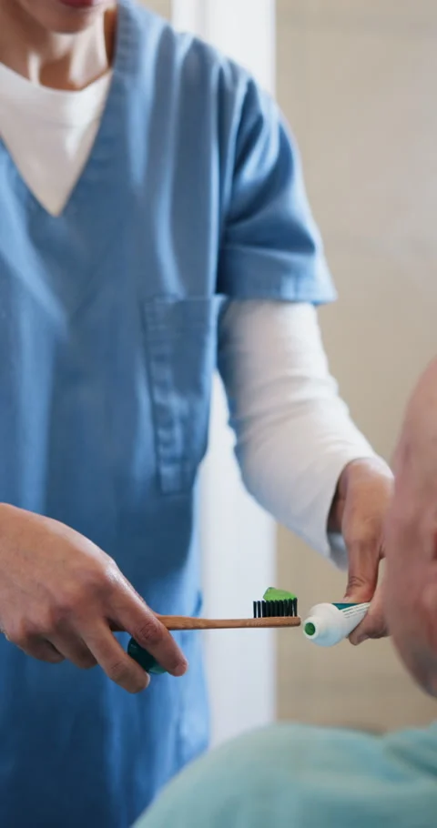 Help, nurse and senior man brushing teeth at nursing home for health, wellness Stock Footage 333171073
