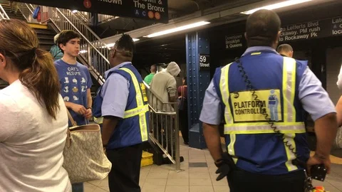Help on NYC subway platform Stock Footage 85799744