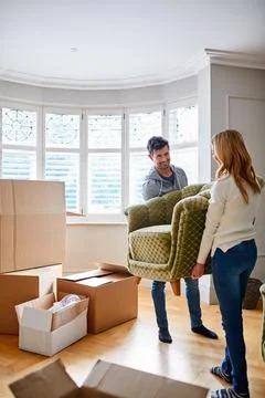 Help, sofa and couple in new home for relocation, packing furniture and moving Stock Photos
