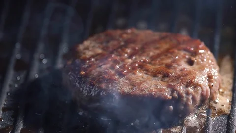 With the help of spatula, the cutlet is grilled, pressed harder to the hot Stock Footage 115776070