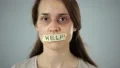 Help tape on womans mouth, silent request for help and protection, tyranny 4k or 4k+ Resolution