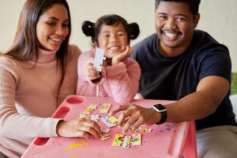 Help them develop problem solving skills at a young age. young parents helping Stock Photos