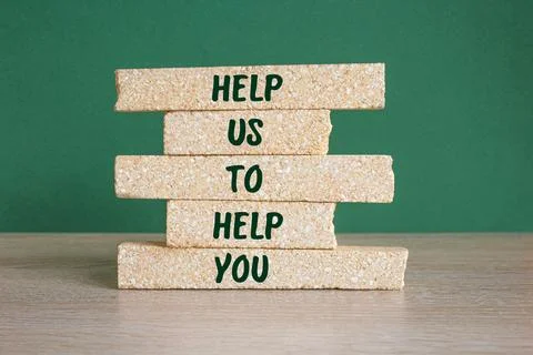 HELP US TO HELP YOU word on brick blocks. Beautiful green background Stock Photos