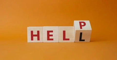 Help vs Hell symbol. Turned wooden cube with words Hell and Help. Beautiful o Stock Photos