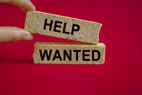 Help wanted and support symbol. Concept words Help wanted on brick blocks. Stock Photos