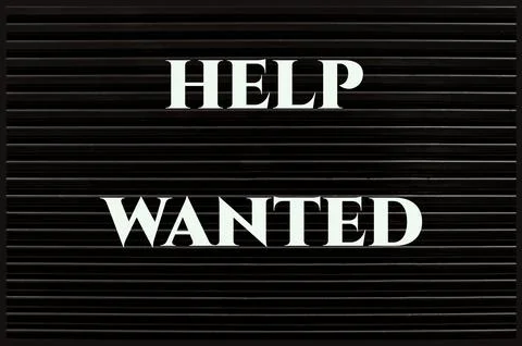 Help Wanted concept on a black board. Stock Photos