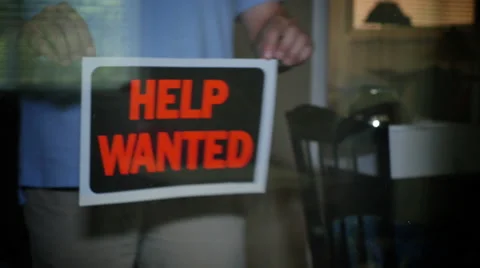 Help Wanted Sign is Placed in Store Window Stock Footage
