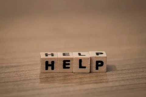 Help in wooden cubes Stock Photos