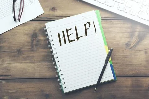 Help word on table and keyboard Stock Photos