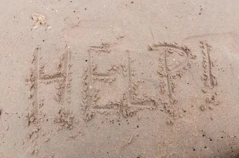 Help! write sand Stock Photos