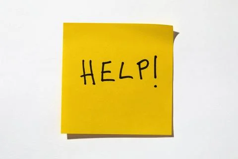 Help written on yellow post it note Stock Photos