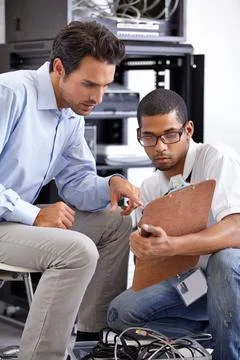 Helpful and reliable tech support. A young IT specialist ready to fix a server. Foto stock