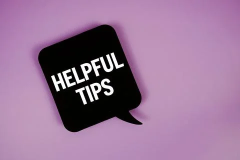 Helpful Tips text with speech bubble top view on purple background Stock Photos