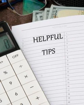 Helpful Tips words in a notebook in a ruler on a blank sheet Stock Photos