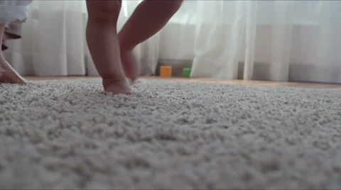 Helping Baby to Make First Steps Stock Footage 66470504
