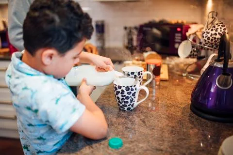 Helping Dad Make Tea Photos