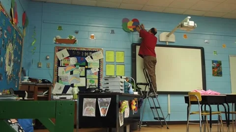 Helping decorate a classroom Stockbeeldmateriaal 45683946