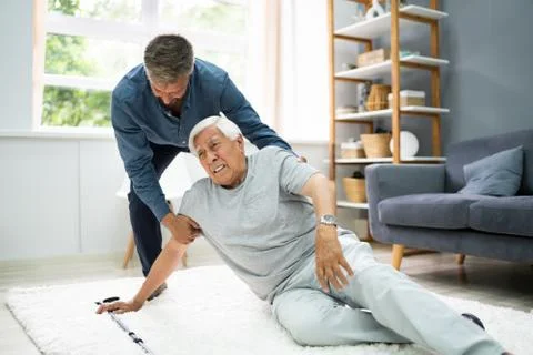 Helping Elder Senior Fallen Man Stock Photos