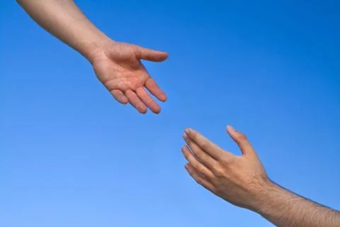 Helping hand reaching Stock Photos