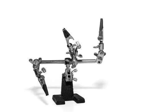 Helping hand, third hand or auxiliary clip tool, platinum holder in front o.. Stock Photos