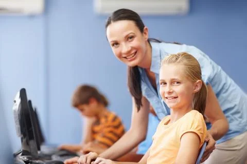 Helping her students through interactive learning. Portrait of an attractive Stock Photos