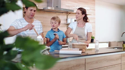 Helping mum to bake Stock Footage 60790374