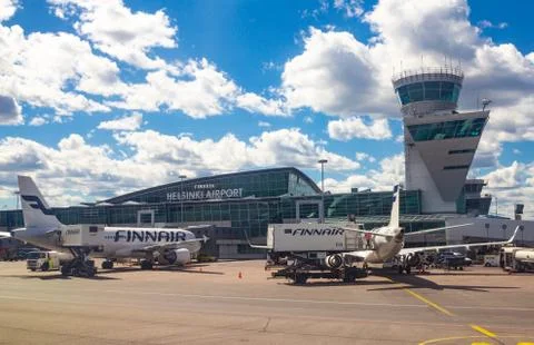 Helsinki Airport Finland 26.07.2019: Finnair airline technicians men load Stock Photos