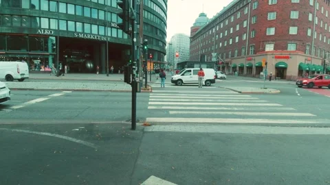 Helsinki Downtown Busy Intersection with Road Traffic and People at Zebra 動画素材 250769844