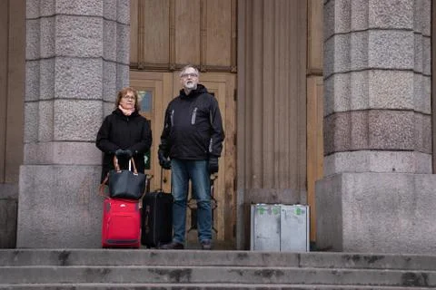 Helsinki, Finland - 3 March 2020: Tourists standing near entrance of Rautatie Stock Photos