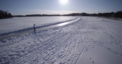 Helsinki Finland ice tour skating woman winter sun arctic follow track 2 4K Stock Footage