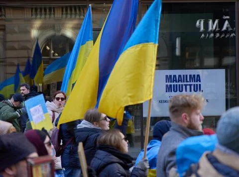Helsinki, Finland - March 5, 2022: Demonstrators with a Ukrainian flag in a rall Stock Photos