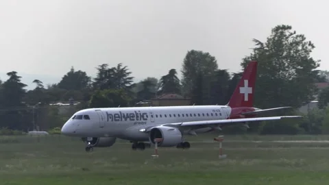 Helvetic Airways, Embraer E190-E2 takeoff at Bologna G.Marconi Airport Stock Footage 248772051