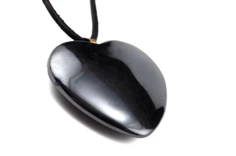 Hematite heart with leather string Stockfoto's