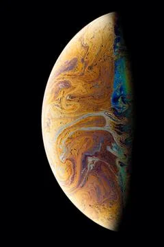 A hemisphere of a soap bubble with a beautiful pattern on a black background. Stock Photos