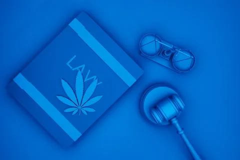 A hemp leaf lies on the book next to the judge's hammer and scales, abstract Stock Illustration
