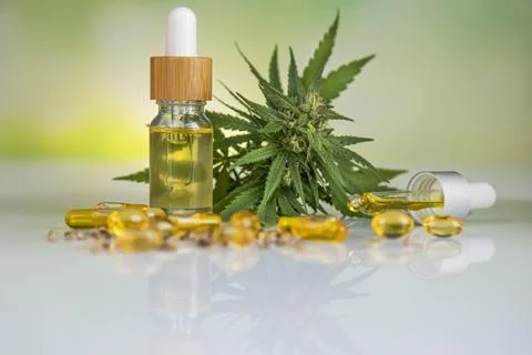 Hemp oil bottle with hemp leaf and cannabis leaf, marijuana Stock Photos