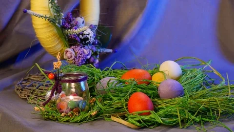 Hen and Quail Eggs, a Bottle With Candle, and a Yellow Ring With a Bunch of Stock Footage 73499204