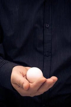 Hen egg hand man Stock Photos