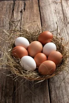 Hen eggs on a rustic background Stock Photos
