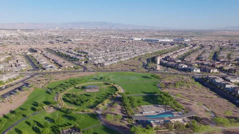 Henderson Nevada Park Lake Pullback Aerial With Suburban Homes 02 Stock Footage 336512756