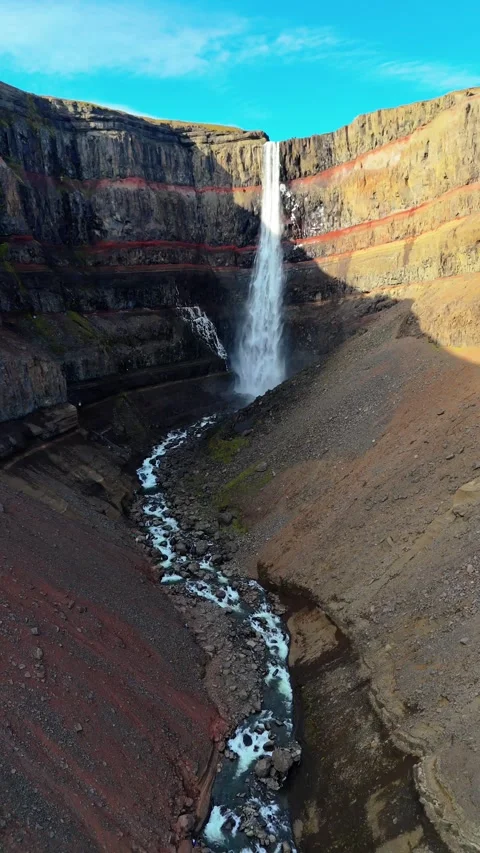 Hengifoss Waterfall Flowing Through Layered Canyon in Iceland Stock Footage 342268803
