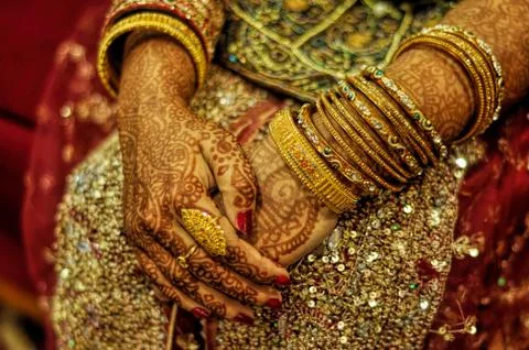 Henna on brides hands Stock Photos