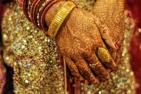 Henna on brides hands Stock Photos