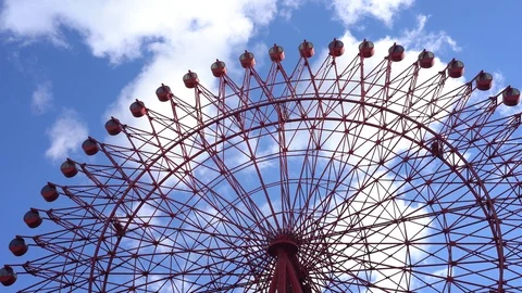 HEP Five ferris wheel is seen over blue sky near Hankyu Umeda Station Stock Footage 98991862
