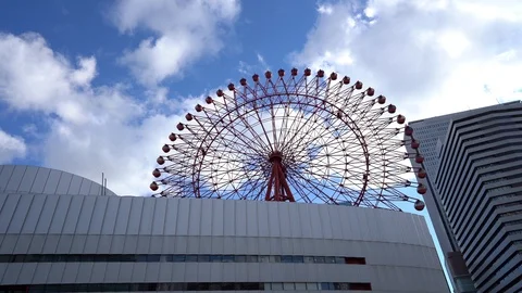 HEP Five ferris wheel is seen over blue sky near Hankyu Umeda Station Stock Footage 98992158