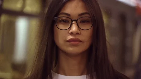 Her hair develops from the wind of a passing train. Video stock 114126612