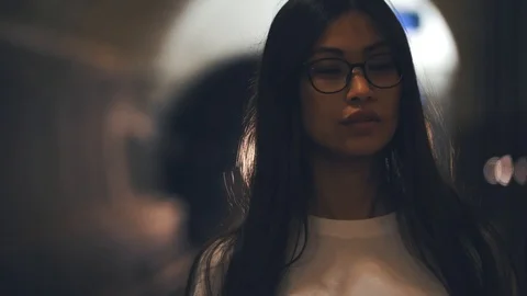 Her hair develops from the wind of a passing train. Stock Footage 114126875