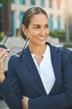 Her professional image is first class. a modern businesswoman in the city. Stock Photos