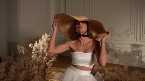 Her wedding top was a work of art, adorned with intricate details and lace. 库存影片 239846427